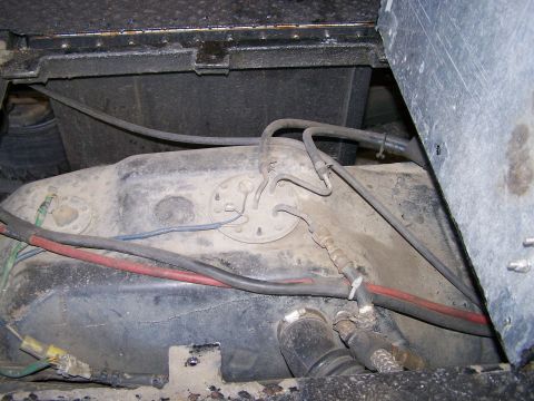 1988 Suzuki Samurai - Underside view of a vehicle's fuel tank and associated lines, showing the fuel pump assembly.