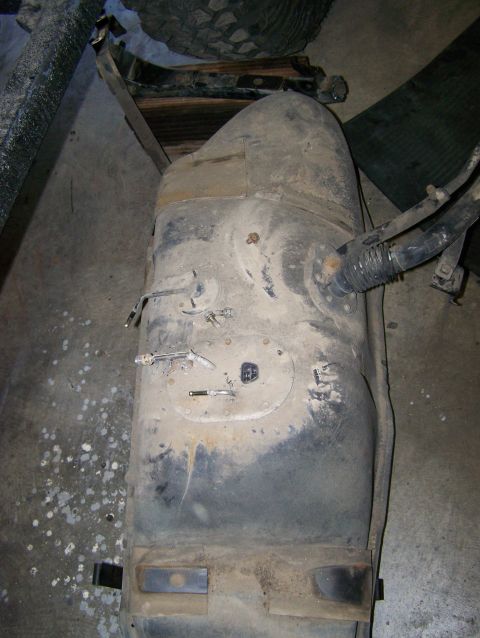 1988 Suzuki Samurai - This is a fuel tank for a Suzuki Samurai, likely removed for maintenance or modification.