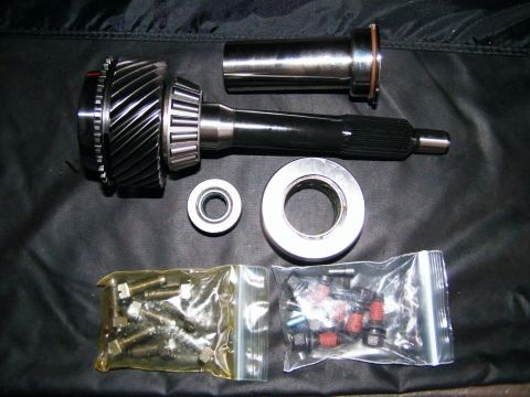 2004 Ford Crown Victoria - Transmission parts laid out, including gears, bearings, and fasteners.