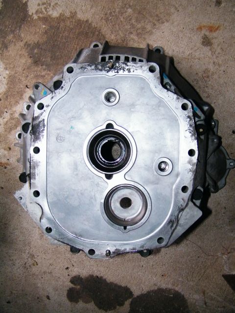 2004 Ford Crown Victoria - This is a close-up view of a transmission component, likely a housing or adapter plate.