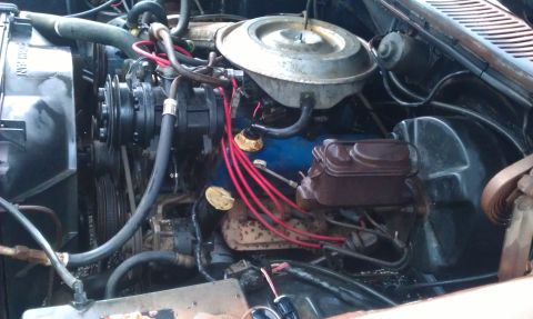1982 Ford Bronco - Close-up view of a vehicle's engine bay, showing various components and wiring.