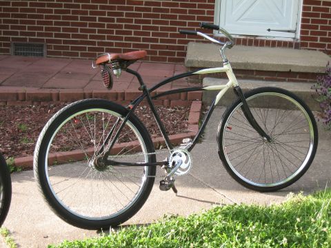 1994 Ford Bronco - A custom cruiser bicycle with a distinctive frame design is parked on a sidewalk.