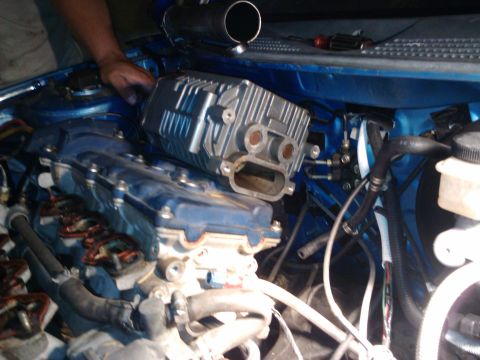 1995 Ford Probe - Supercharger installation in progress on a vehicle's engine bay.