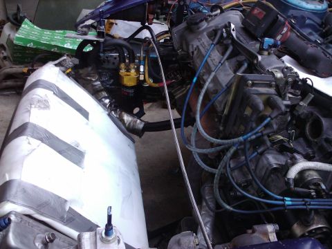 1995 Ford Probe - Close-up view of an engine bay, showing complex wiring and plumbing systems.
