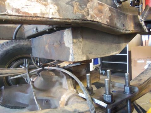 1968 Ford Bronco - A custom fuel tank is visible mounted beneath the chassis, obscuring the original vehicle components.