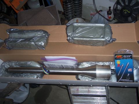 1968 Ford Bronco - Unboxed steering column and a billet aluminum dress-up kit, likely for a vehicle modification project.