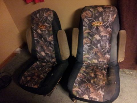 1986 Ford Bronco - Two camouflage car seats with "FLX" logos are shown, likely aftermarket or custom seat covers.