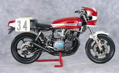 2008 Ford Crown Victoria - Side view of a red Yoshimura motorcycle with racing number 34, displayed on a stand.