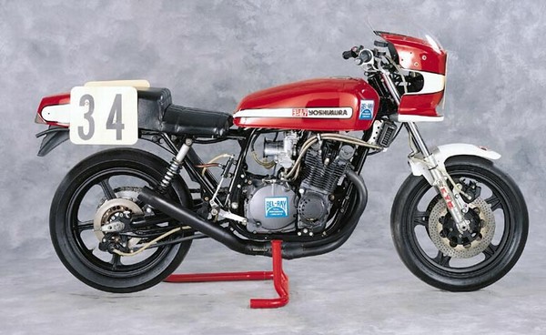 Red Yoshimura motorcycle with number 34 on the rear fender, on a red stand