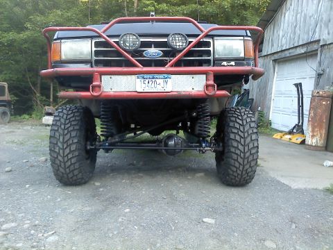 1995 Ford F-150 - Modified Ford truck front end with custom bull bar and suspension modifications.