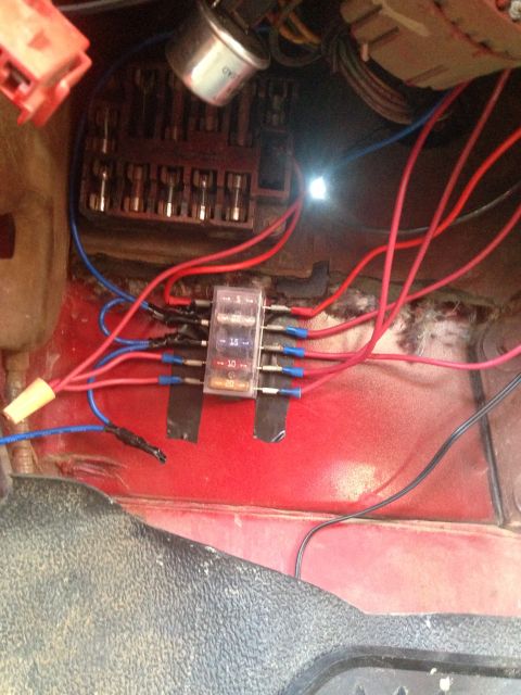 1979 Ford Bronco - Close-up view of a vehicle's electrical fuse box and associated wiring.