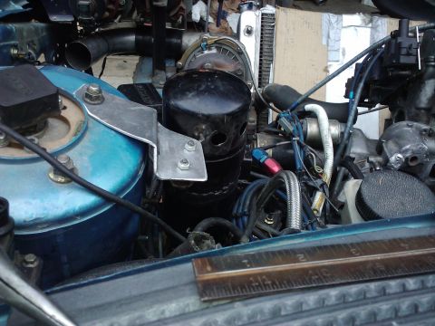 1995 Ford Probe - Close-up view of a modified engine bay, various hoses, components, and a ruler placed on the radiator support.