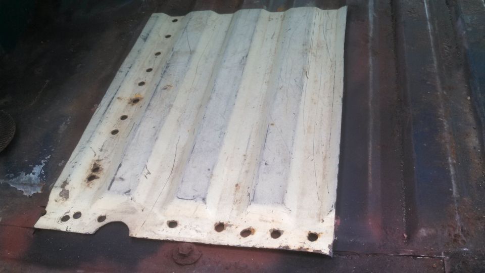 Corrugated metal panel with holes along edges