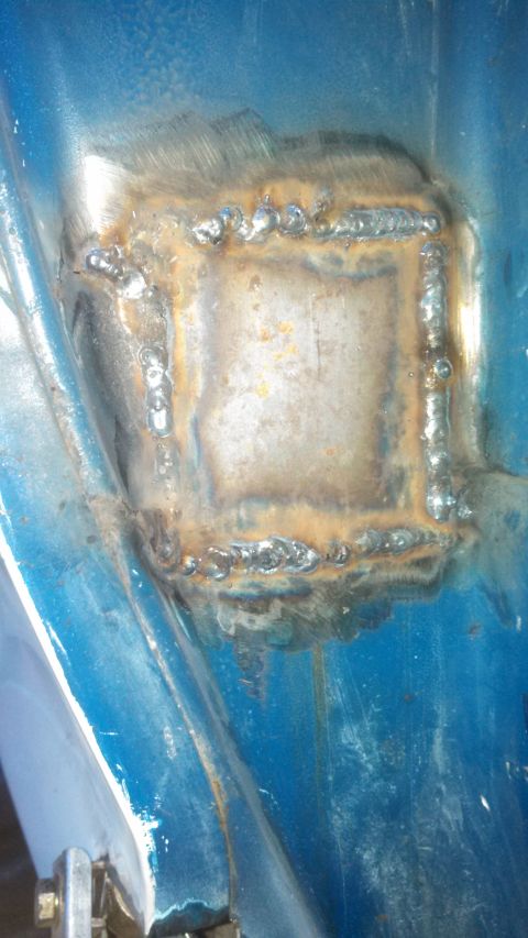 1979 Ford Bronco - A patch has been welded onto the vehicle's body, showing signs of rust and repair work.