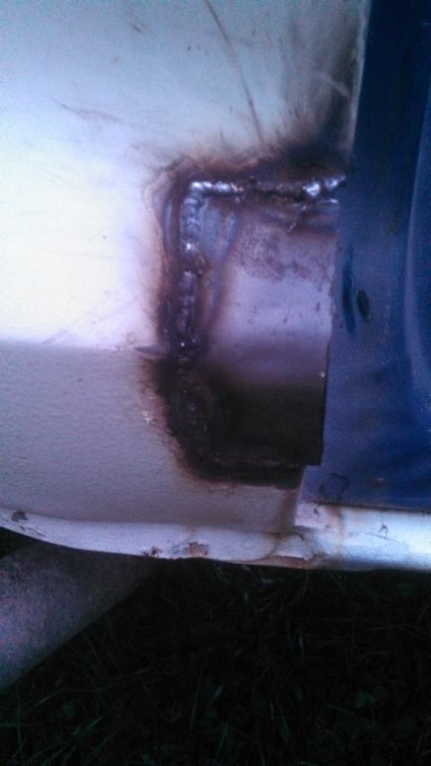 1979 Ford Bronco - This image shows a section of a vehicle's body with evidence of repair work and corrosion.