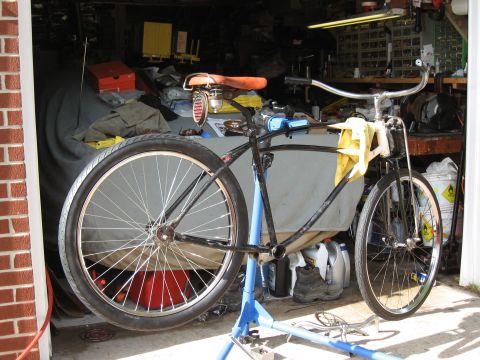 1994 Ford Bronco - Bicycle frame on a repair stand in a garage setting.