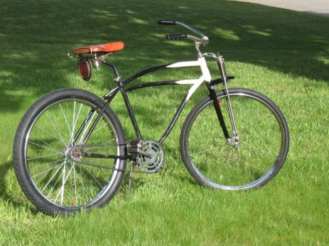 1994 Ford Bronco - A vintage bicycle with a distinctive frame design sits on a grassy lawn.