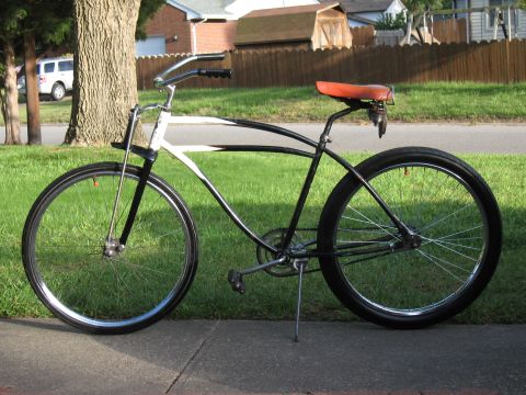 1994 Ford Bronco - A vintage bicycle with a distinctive frame design and orange saddle is shown outdoors.