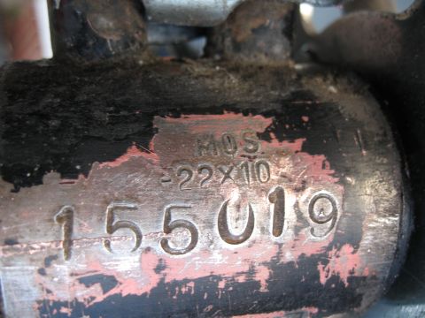 1994 Ford Bronco - Close-up of a metal part showing stamped identification numbers and text.
