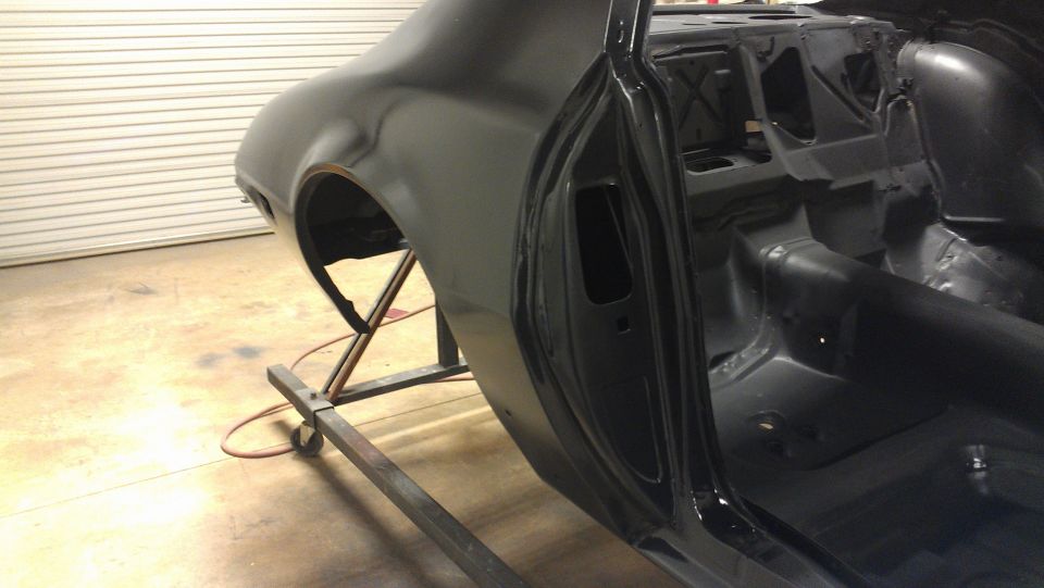 Black 1972 Pontiac Trans Am interior and rear quarter panel during restoration