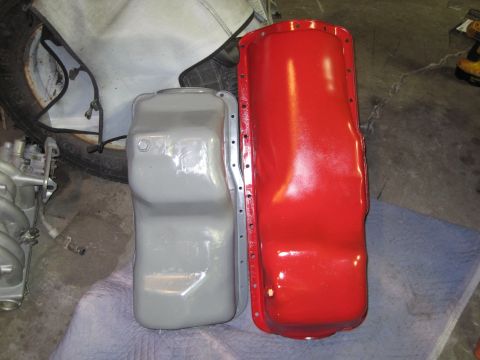 1989 Ford Bronco - Comparison of two different oil pans, one painted gray and the other red.