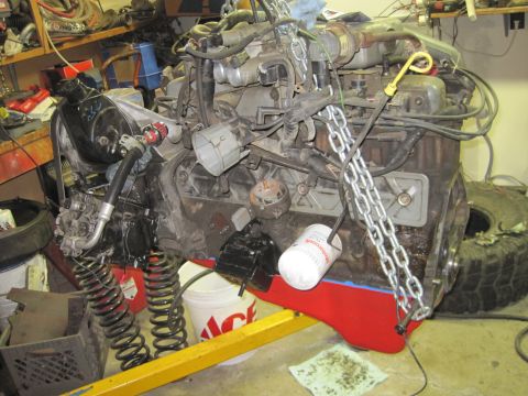 1989 Ford Bronco - Close-up view of engine parts and mechanical components.