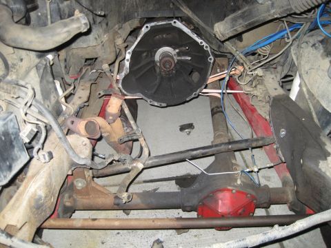 1989 Ford Bronco - Close-up view of a disassembled engine bay, revealing internal mechanical structures and wiring.