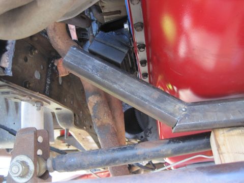 1989 Ford Bronco - Custom metal bracket installed on the vehicle's frame, near the engine components.