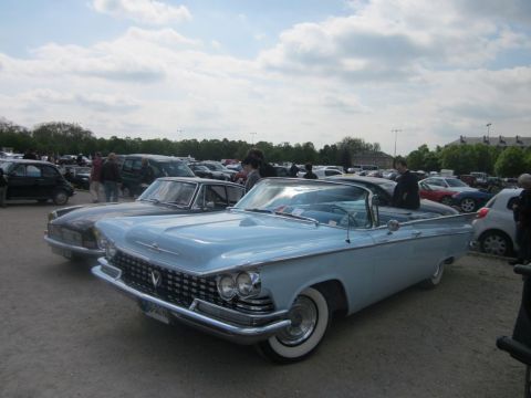 1991 Ford LTD Crown Victoria - Light blue 1959 Buick LeSabre convertible at a car meet.