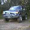 1988 Ford Bronco - This 1988 Ford Bronco features off-road tires and a brush guard, presented in a 3q-front view.