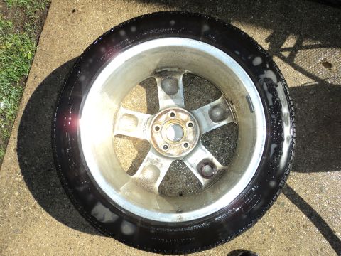 2004 Mercury Grand Marquis - A close-up view of a single car wheel and tire, appearing to be cleaned.