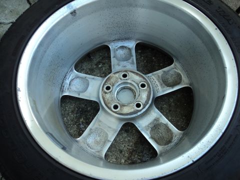 2004 Mercury Grand Marquis - A close-up view of a five-spoke alloy wheel, showing its design and tire.
