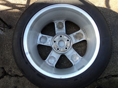 2004 Mercury Grand Marquis - This is a close-up view of a single wheel and tire assembly.