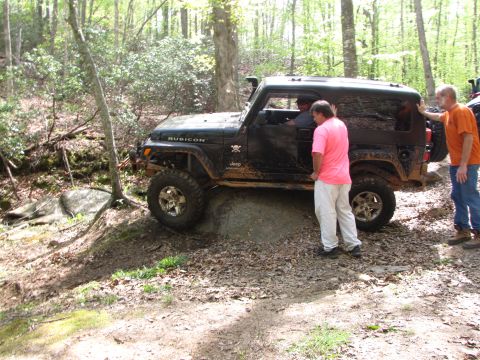 1979 Ford Bronco - Off-road enthusiasts navigate a challenging trail with their Jeep Wrangler Rubicon.