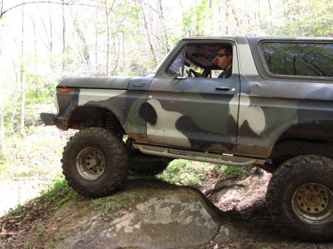 1979 Ford Bronco - This lifted Ford Bronco is shown off-roading on a rocky trail.