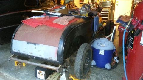 2005 Ford Mustang - Car body undergoing restoration in a workshop setting.
