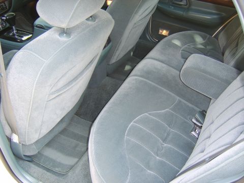 1996 Mercury Grand Marquis - Interior view of a 1996 Mercury Grand Marquis, highlighting the cloth seating and dashboard details.