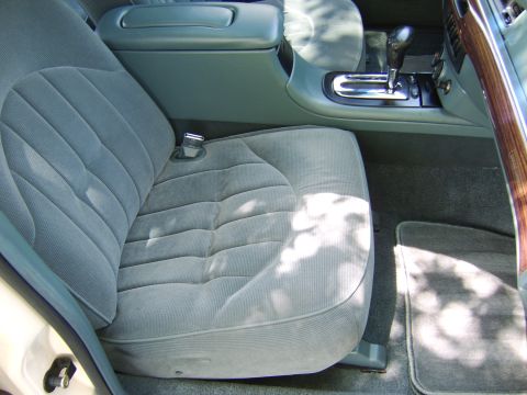 1996 Mercury Grand Marquis - Interior view of a 1996 Mercury Grand Marquis, highlighting the passenger seat and center console.
