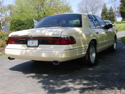 1996 Mercury Grand Marquis - Rear view of a 1996 Mercury Grand Marquis parked on asphalt.
