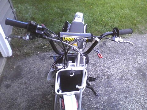 2003 Ford Crown Victoria - Overhead view of dirt bike handlebars and front section, showing controls and front plate.