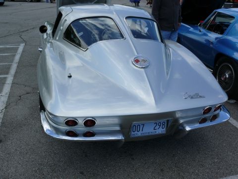 1968 Chevrolet Camaro - Rear view of a 1963 Corvette Sting Ray coupe, parked next to another car.