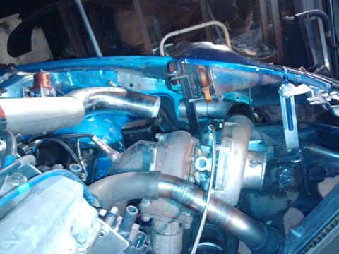 1995 Ford Probe - Custom engine bay modifications a turbocharger and associated plumbing.