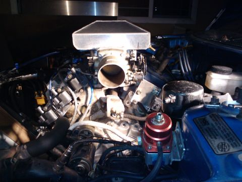 1995 Ford Probe - Close-up view of an engine bay aftermarket performance parts and wiring.