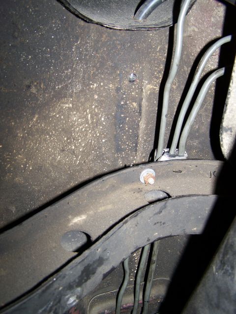1988 Suzuki Samurai - Brake lines are secured to the vehicle's undercarriage with clips and bolts.