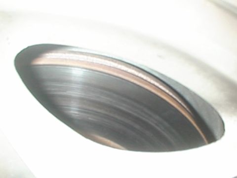 1999 Ford Taurus - This image shows a close-up view of a brake rotor, not a 1999 Ford Taurus.