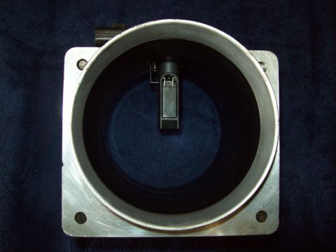 1993 Ford F-150 - A mass air flow sensor is shown from the interior, with its internal components visible.