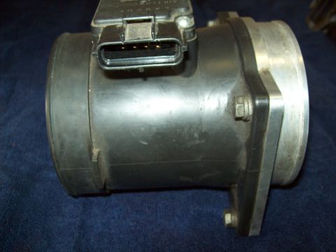1993 Ford F-150 - Close-up of a mass air flow sensor, a critical engine component.