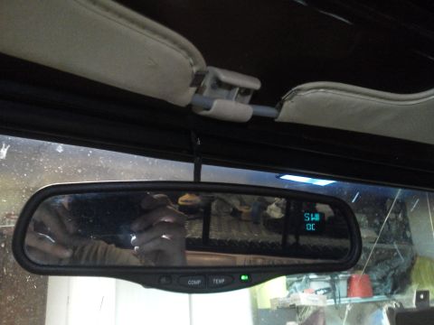 1979 Ford F-150 - The rearview mirror displays digital information, but no vehicle year is discernible from this interior shot.