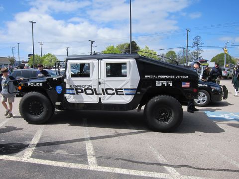 1991 Ford LTD Crown Victoria - black-and-white Barrington Police Hummer H1 marked Special Response Vehicle with people standing nearby in a parking lot.