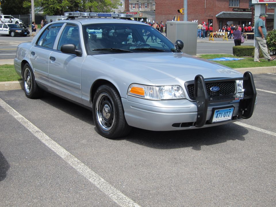 Silver Ford Crown Victoria police sedan with push bar and Connecticut plate